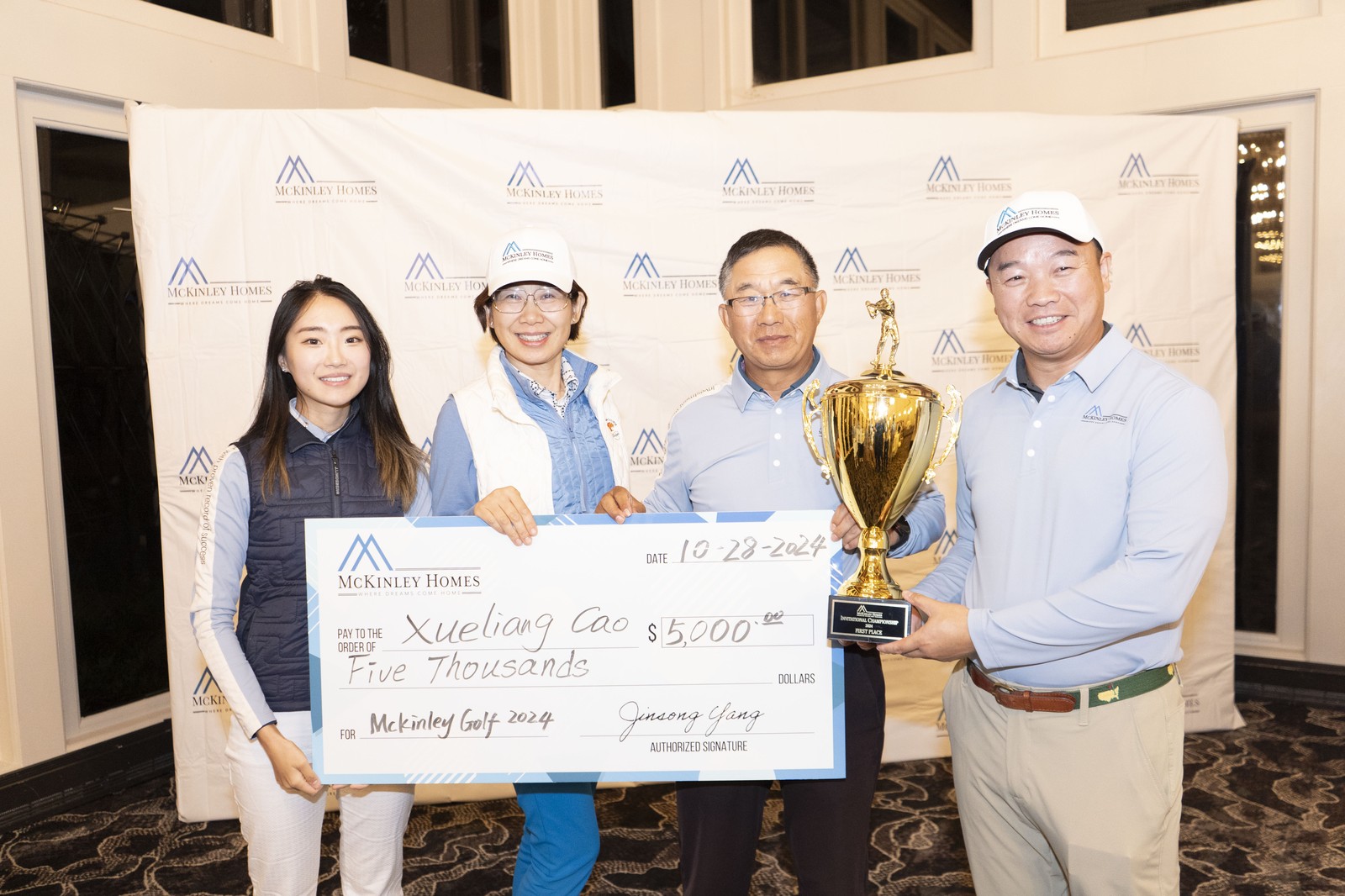 2024 champion Xueliang Cao receiving the first place cheque